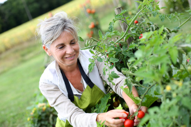 woman in her 50s gardening